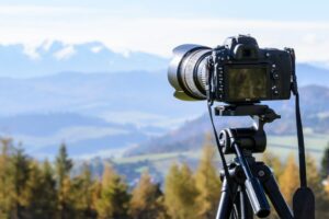 image of camera with mountain landscape